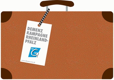 Ein brauner altmodischer Koffer mit einem Anhänger